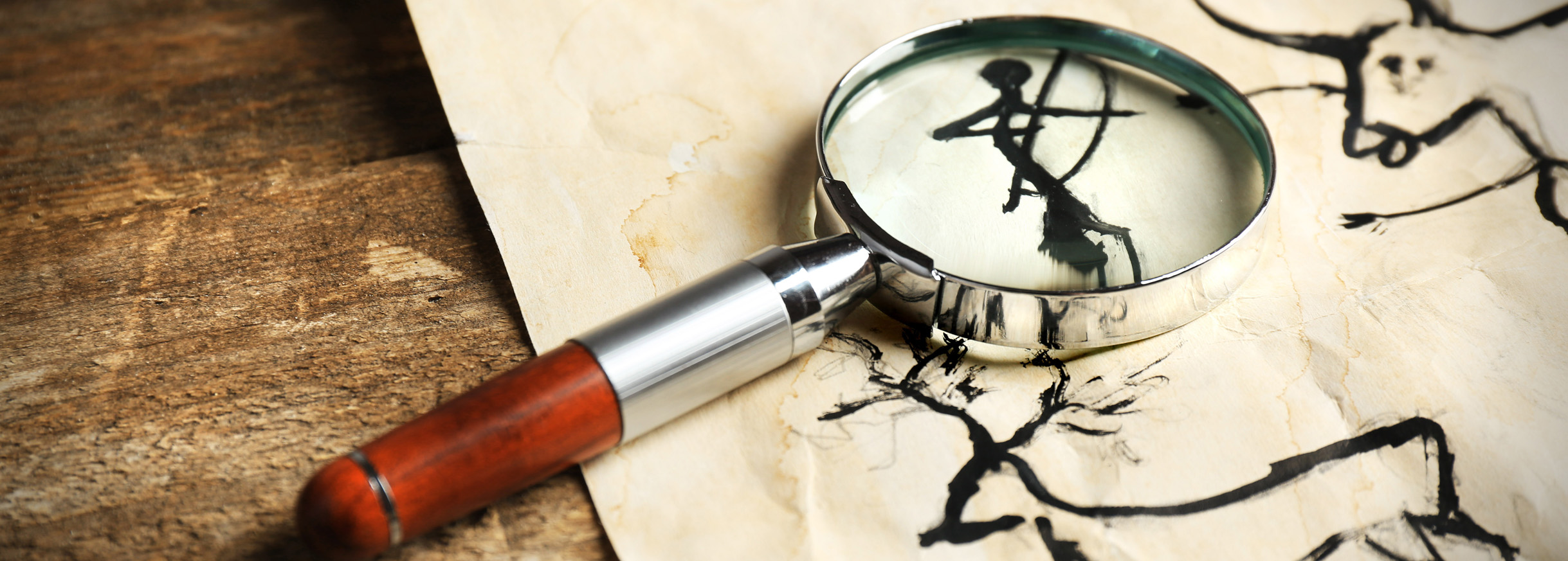Magnifying glass on cave drawings