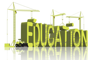 The word education being built with construction equipment